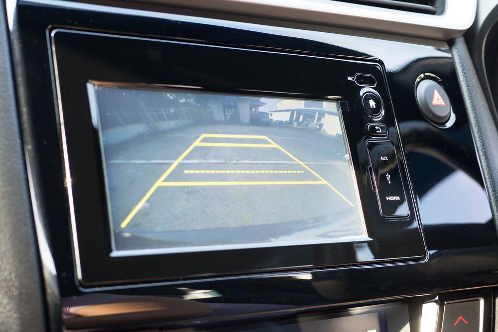 car dashboard showing the view of the back up camera 
