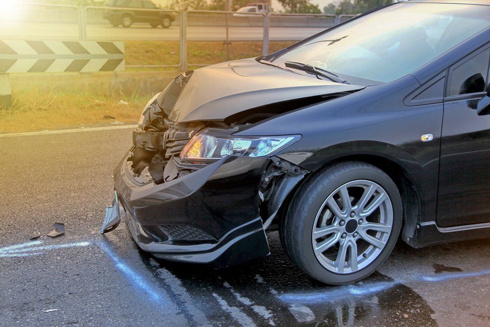 damaged front end of a vehicle after an accident