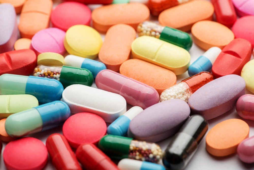 lots of different pills on a table