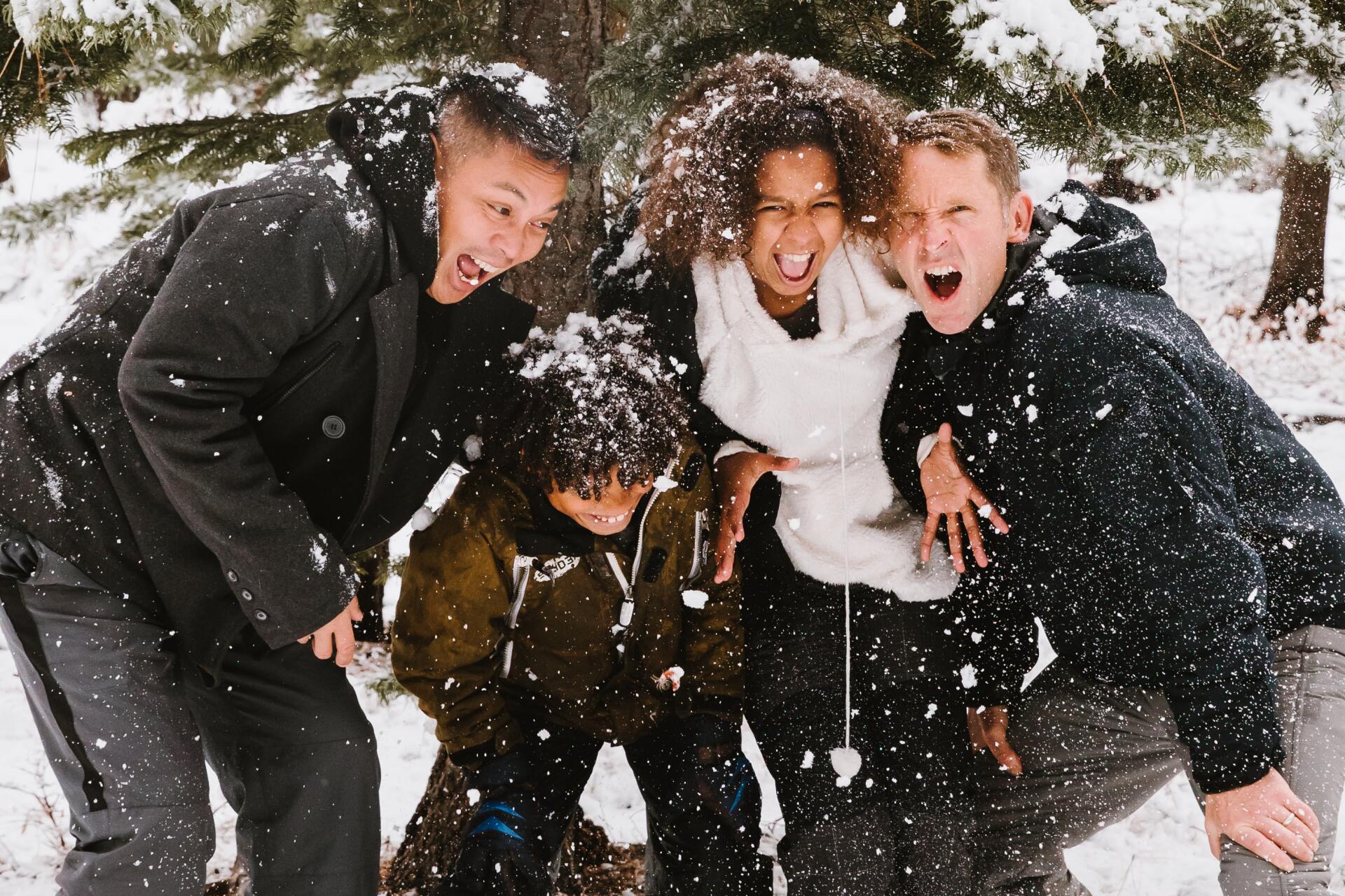 A group of people are posing for a picture in the snow.