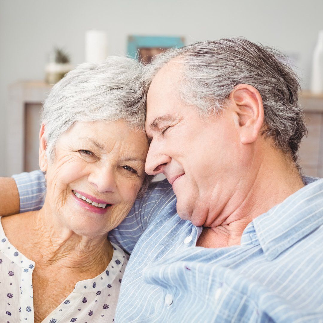 elderly couple smiling together