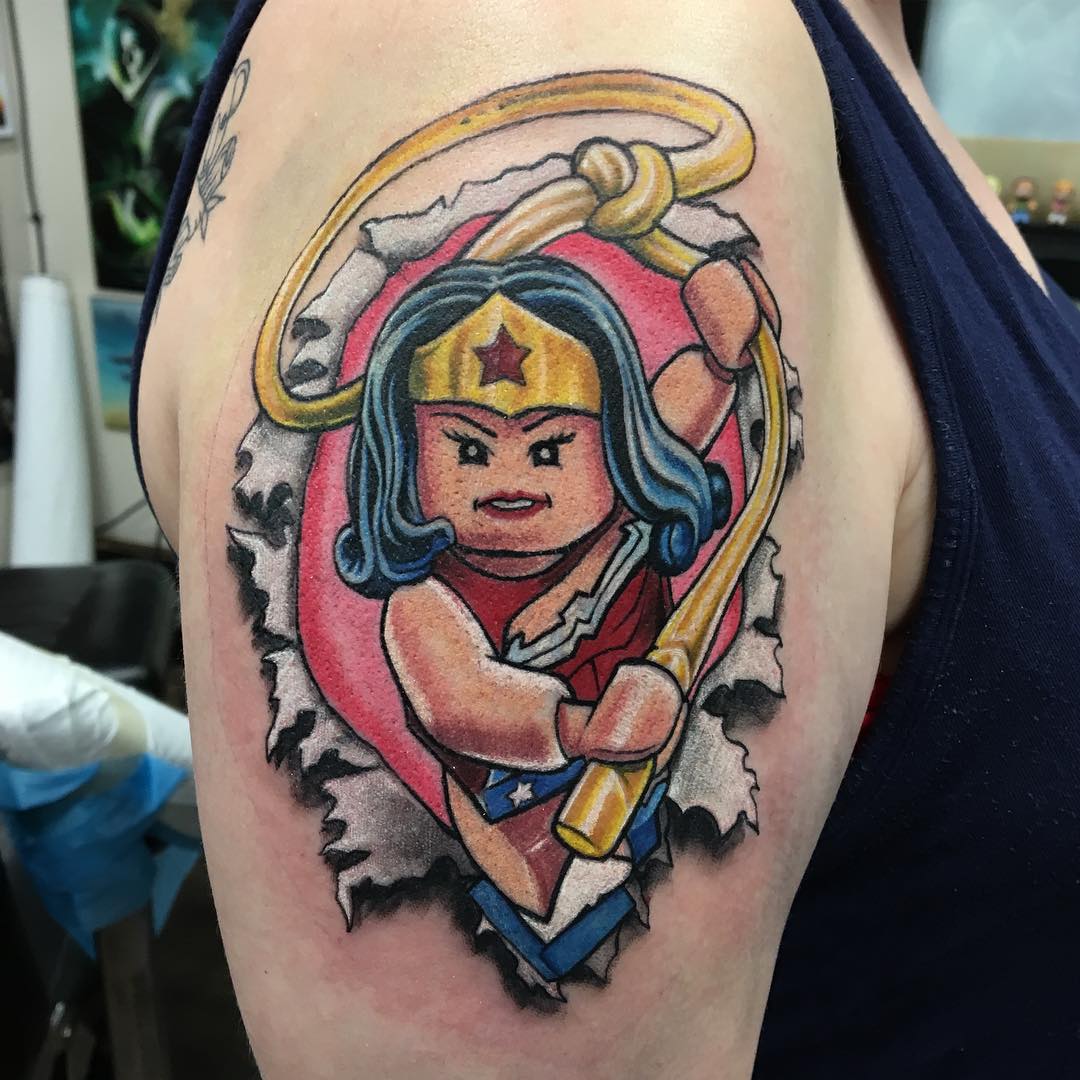 Lego Wonder Woman Tattoo by Chris Labrenz at Black Gold Tattoo Co in Edmonton Alberta Canada