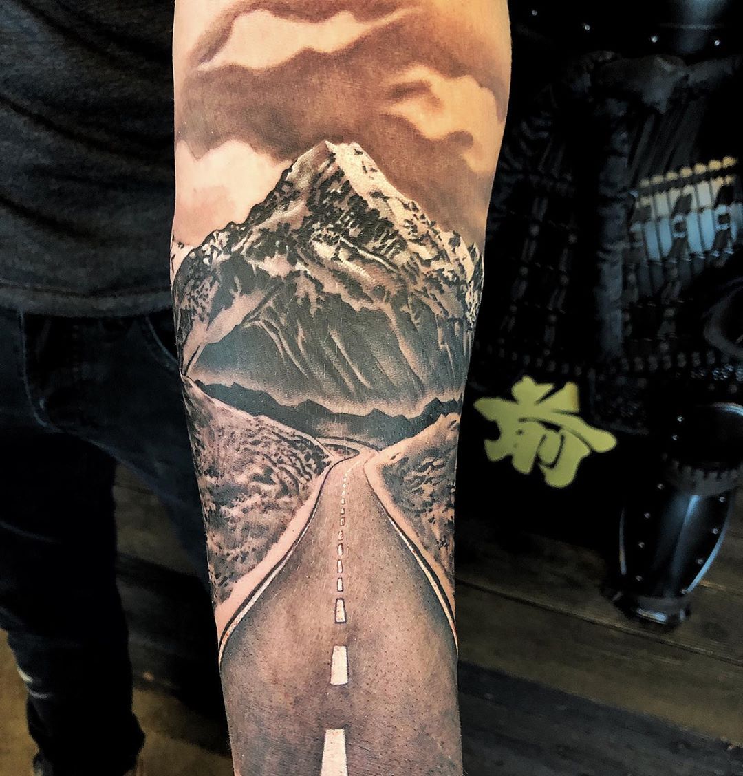 Mountain and Highway Tattoo by Chad Lavers at Crimson Empire Tattoo in Edmonton Alberta Canada