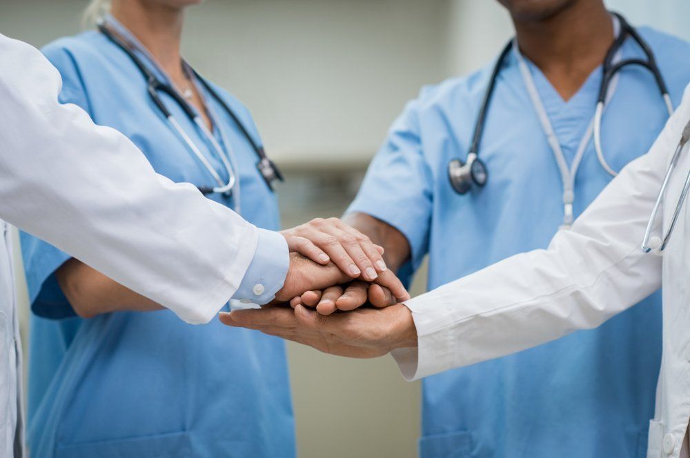 Diabetes Specialist — Doctors Holding Hands Together In Winston Salem, NC Diabetes Specialist — Doctors Holding Hands Together In Winston Salem, NC