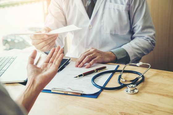 Diabetes Education — Doctor Giving a Reciept To A Patient In Winston Salem, NC Diabetes Education — Doctor Giving a Reciept To A Patient In Winston Salem, NC