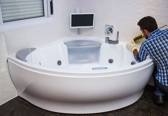 plumber fixing bath tub
