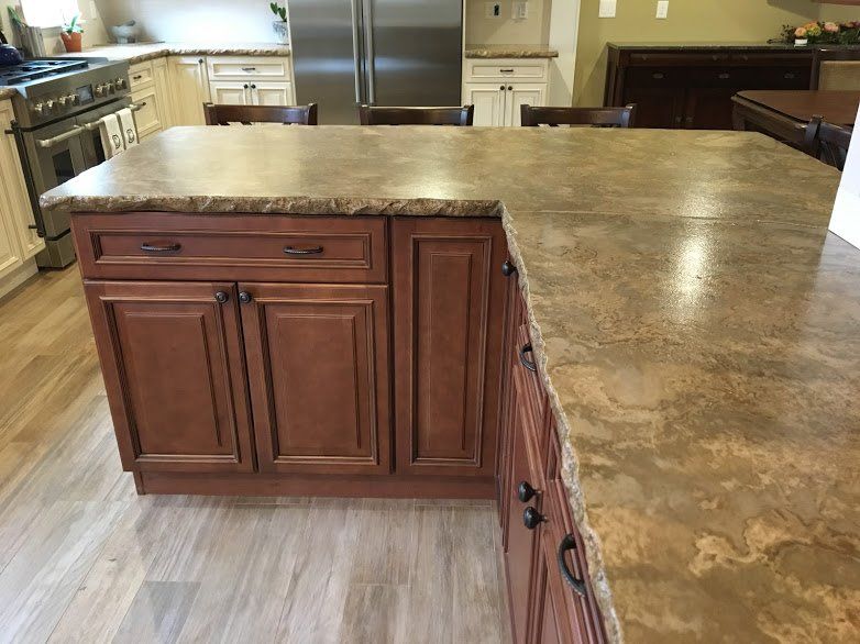 A kitchen with wooden cabinets and granite counter tops