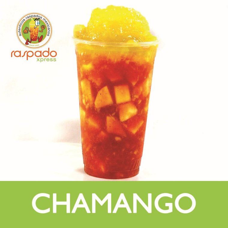 Chamango dessert drink in a clear cup with mango and red sauce.