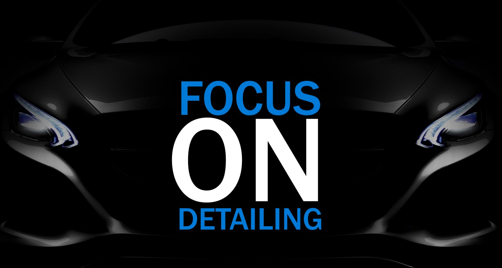 A black car with the words focus on detailing on it