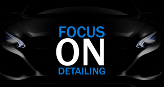 A black car with the words focus on detailing on it