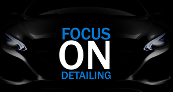 A black car with the words focus on detailing on it