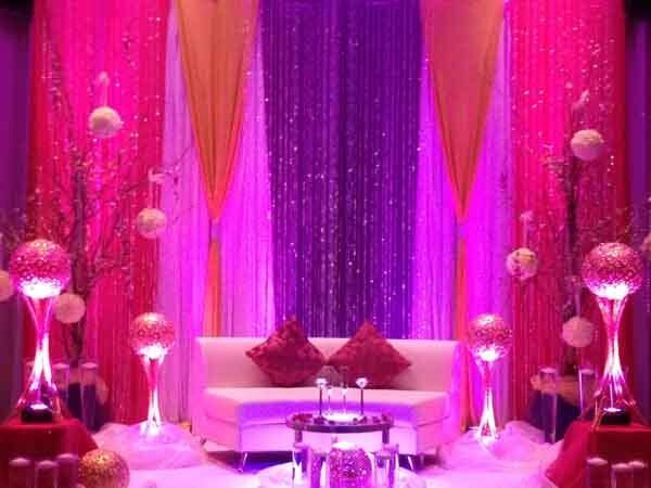 pink drapes behind couch