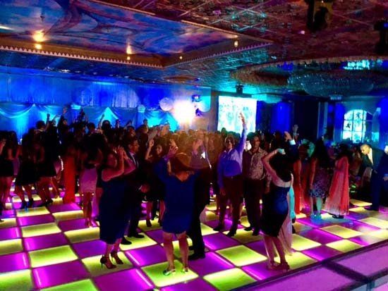 light up dance floor in ballroom with people dancing