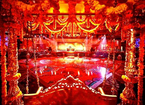 large ballroom filled with read and yellow light