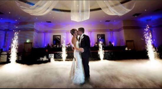 fog effects in ballroom for wedding with bride and groom dancing
