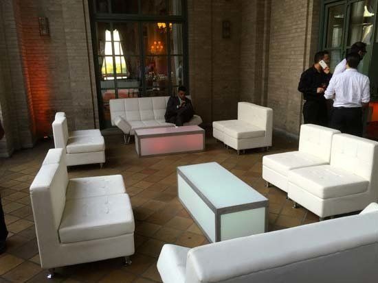 white lounge furniture in a large room