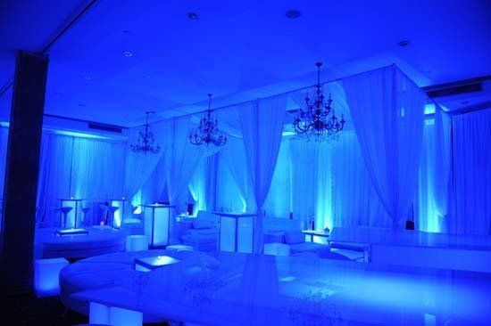 white lounge furniture and decor with blue lights