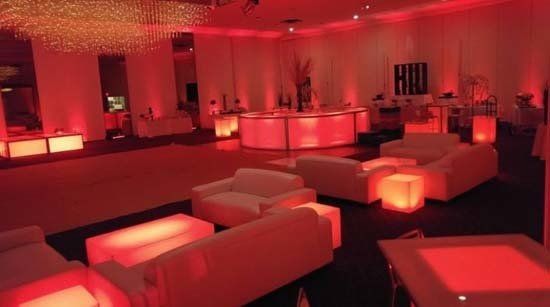 white lounge furniture and decor with orange lights