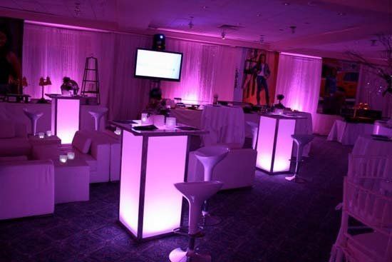 lounge furniture at party with pink light up pillars