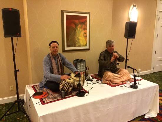 two men setting up table