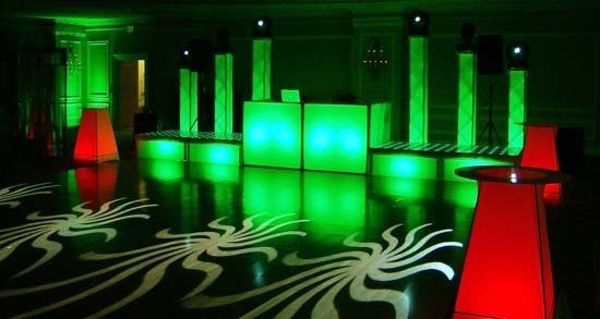 dj behind green desk