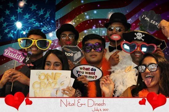 group of people posing for a photo booth photo