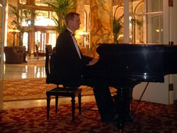 man playing music at piano