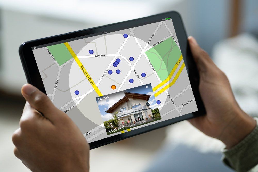 House Searching on Tablet — Spartanburg, SC — Hanover Title Agency