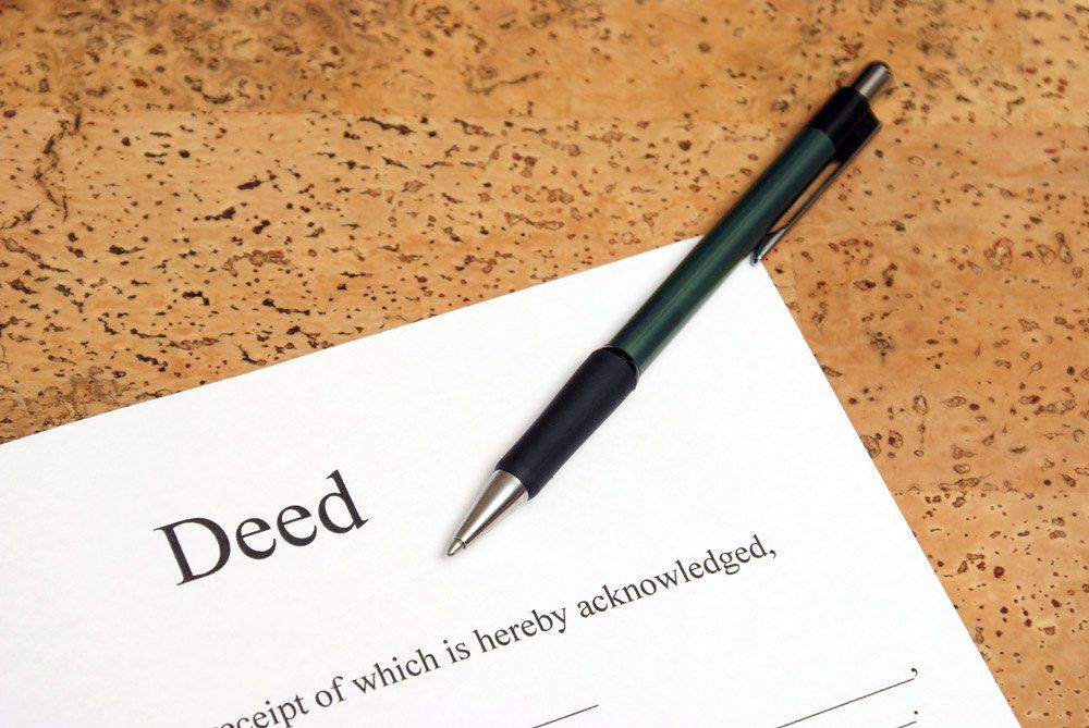 Deed Document and Pen — Spartanburg, SC — Hanover Title Agency