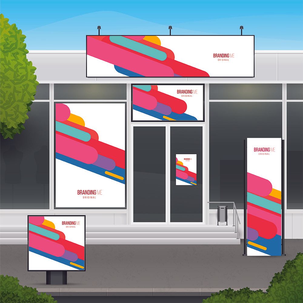 Storefront with various signs displaying colorful abstract shapes, promoting a brand.