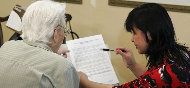 Woman Assisting Senior for Papers — San Marcos, CA — Care Choice Home Care Woman Assisting Senior for Papers — San Marcos, CA — Care Choice Home Care