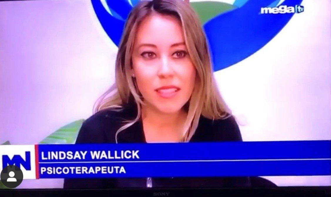 Lindsay Wallick, psychotherapist, speaks on TV with a blue banner and logo visible.