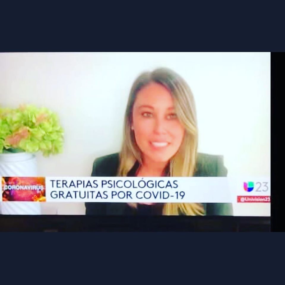 Woman on TV, news segment about free psychological therapy for COVID-19, with text banner.
