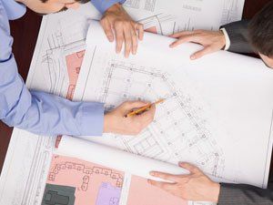 men designing a building