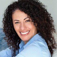 curly hair woman smiling