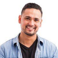 man in late 20s or early 30s smiling