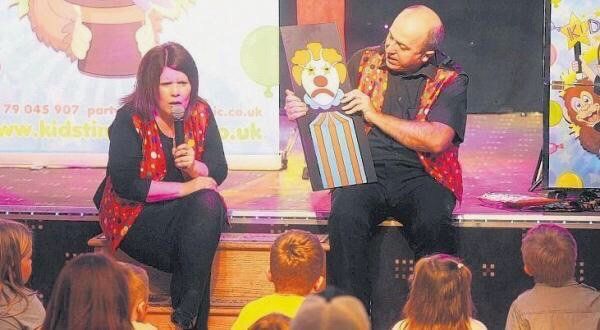 Derek and Suzanne doing a puppet play
