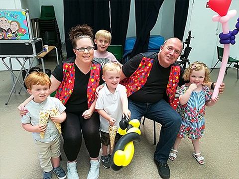 Derek and Suzanne entertaining children