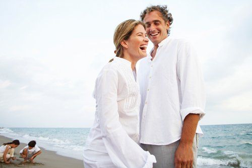 Couple walking on the beach happy couple walking on the beach