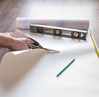 Man Cutting Wallpaper - Wallpaper in Jefferson, MA Man Cutting Wallpaper - Wallpaper in Jefferson, MA