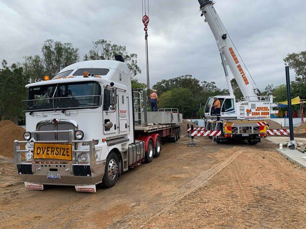 Crane loading onto trailer