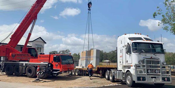 Crane loading onto trailer