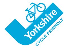 A logo for yorkshire cycle friendly with a bicycle on it