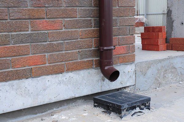 Outdoor Drain During Winter — Elkhart IN — Roto-Rooter Sewer - Drain Services Outdoor Drain During Winter — Elkhart IN — Roto-Rooter Sewer - Drain Services