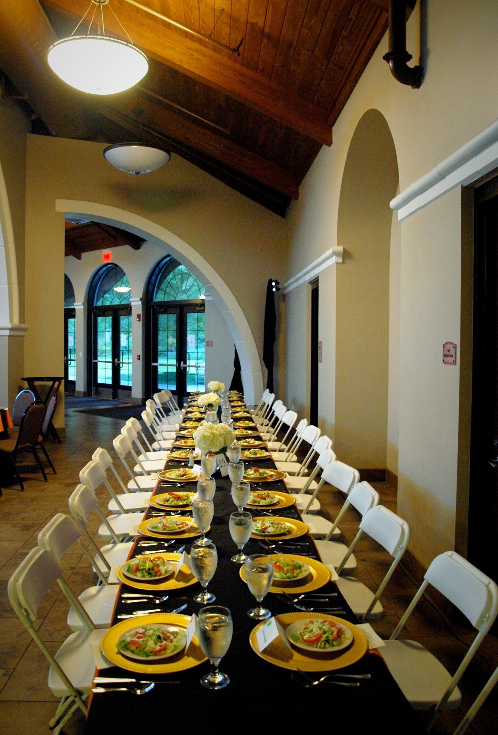 long table set up with plated salads at the Botanical Gardens venue
