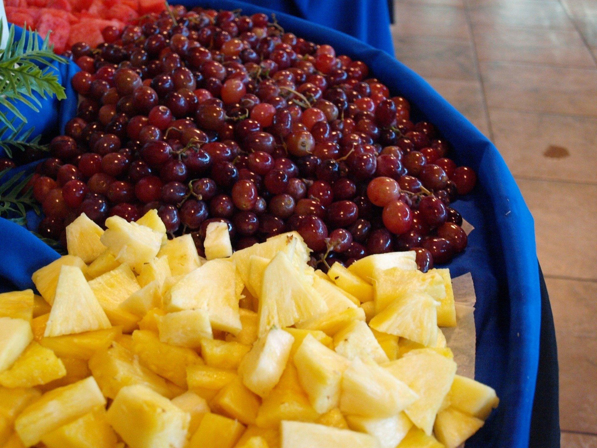 pineapple and grapes on fruit display