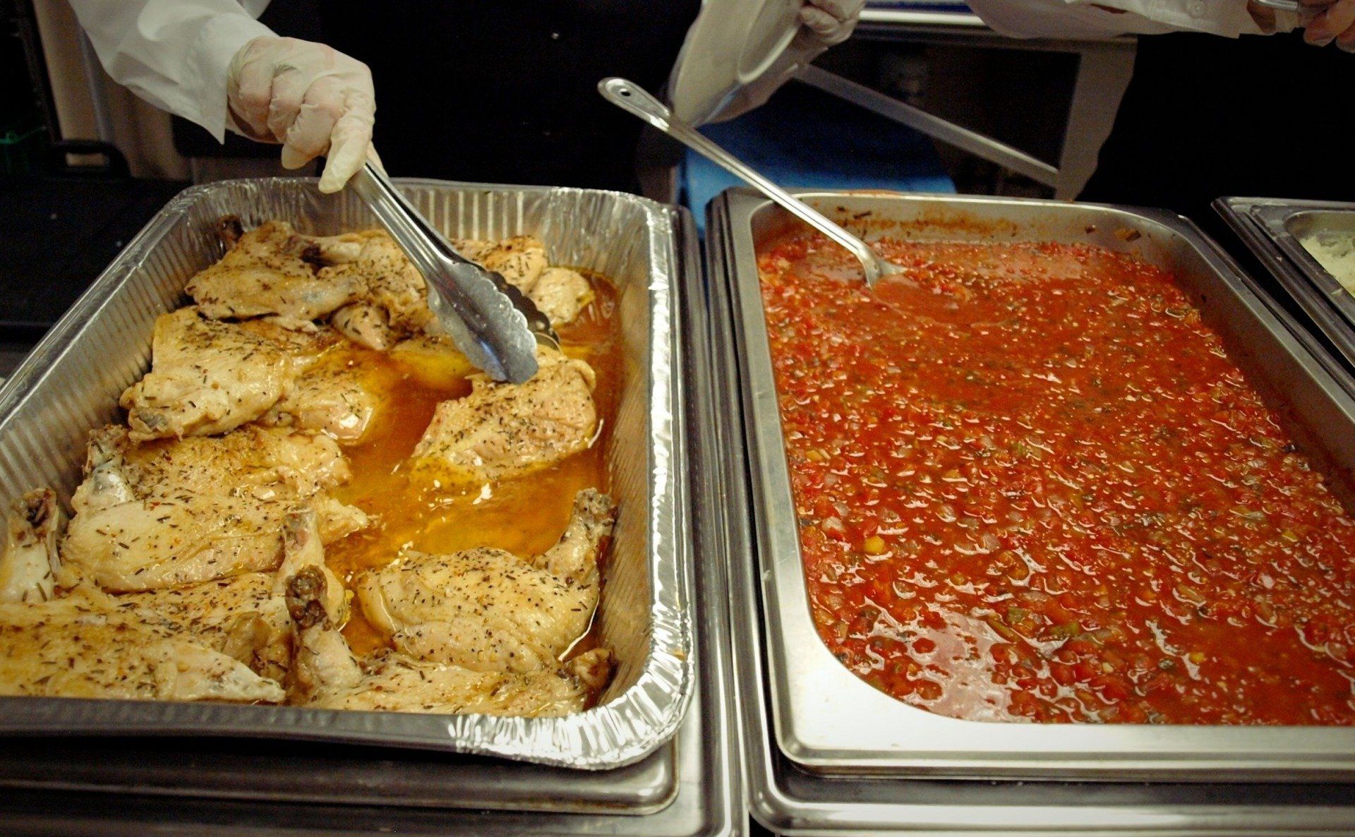 buffet pans one filled with chicken and one with red sauce