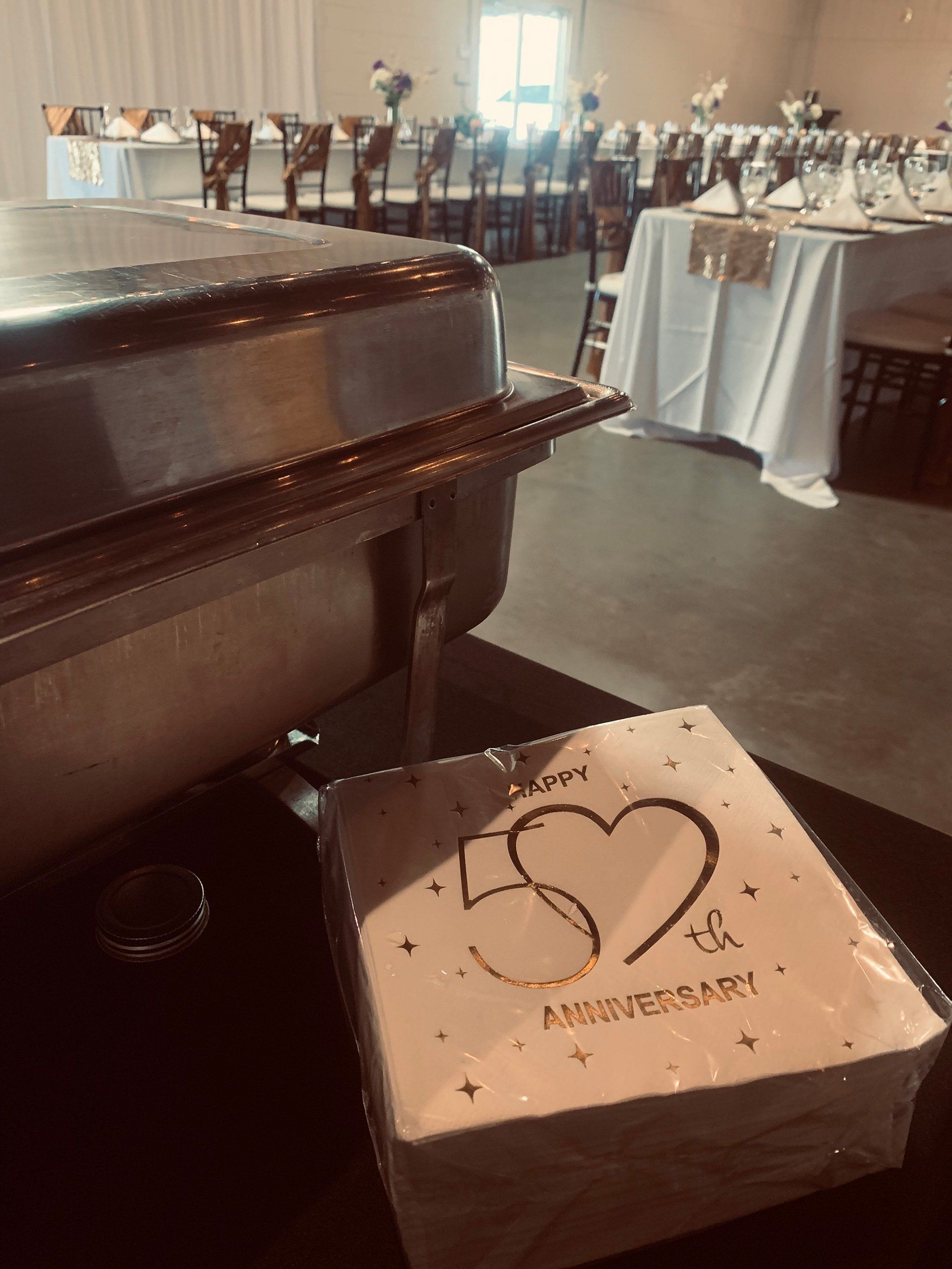 buffet pan with 50th anniversary napkins on table