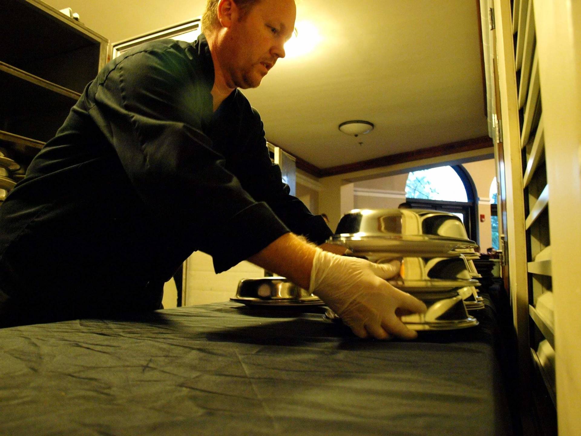 caterer putting out plated food