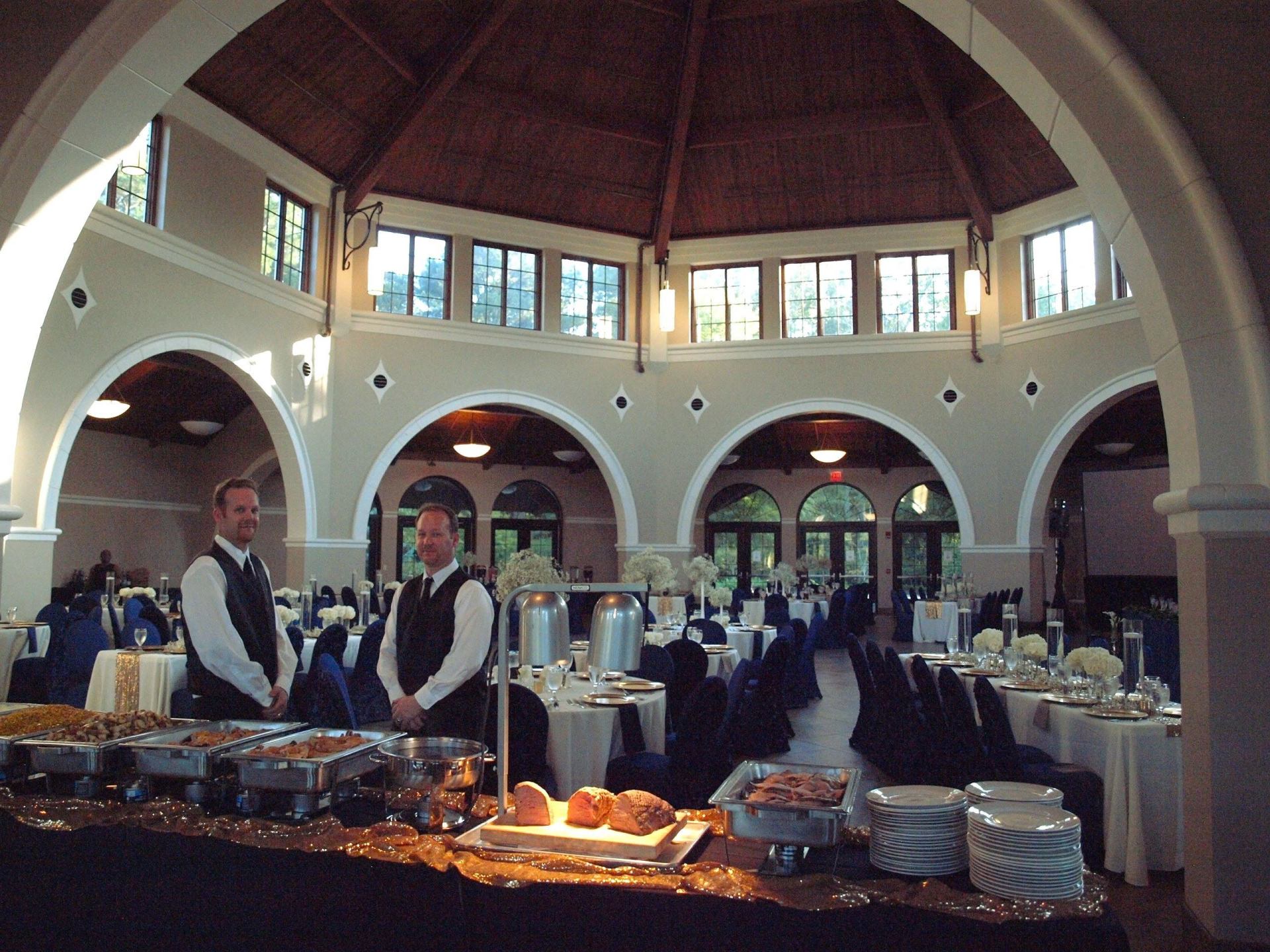 caterers awaiting guests to serve a buffet